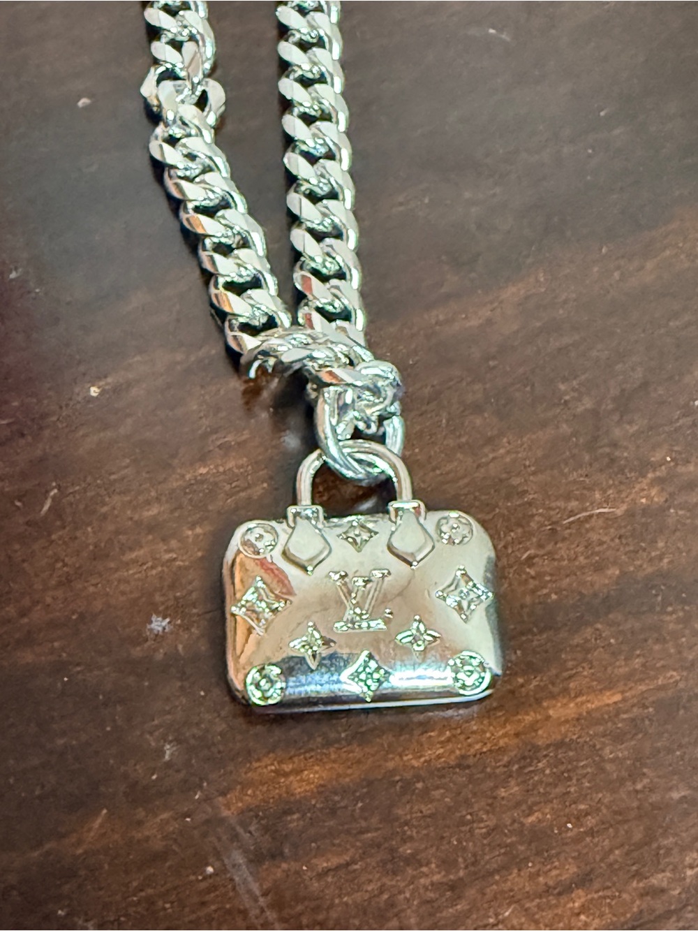 Louis Vuitton EUC Speedy Handbag
Charm on 8” .925 silver plate Cuban
Chain - Picture 5 of 8